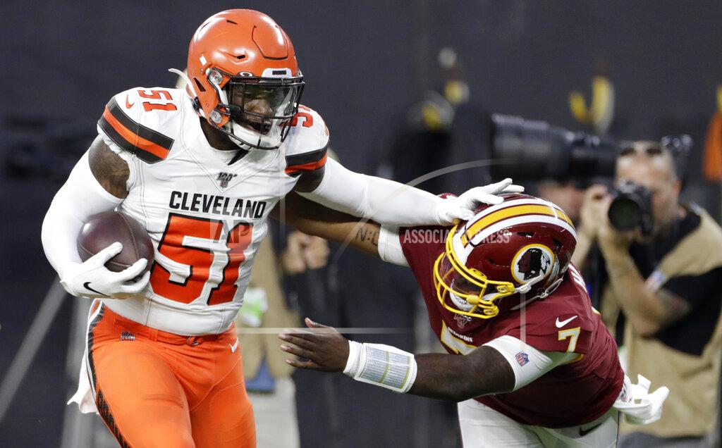 Ron Schwane Cleveland Browns linebacker Mack Wilson (51) returns an interception for a touchdown, as Washington Redskins quarterback Dwayne Haskins (7) reaches for him during the first half of an NFL preseason football game Thursday, Aug. 8, 2019, in Cleveland. (AP Photo/Ron Schwane)