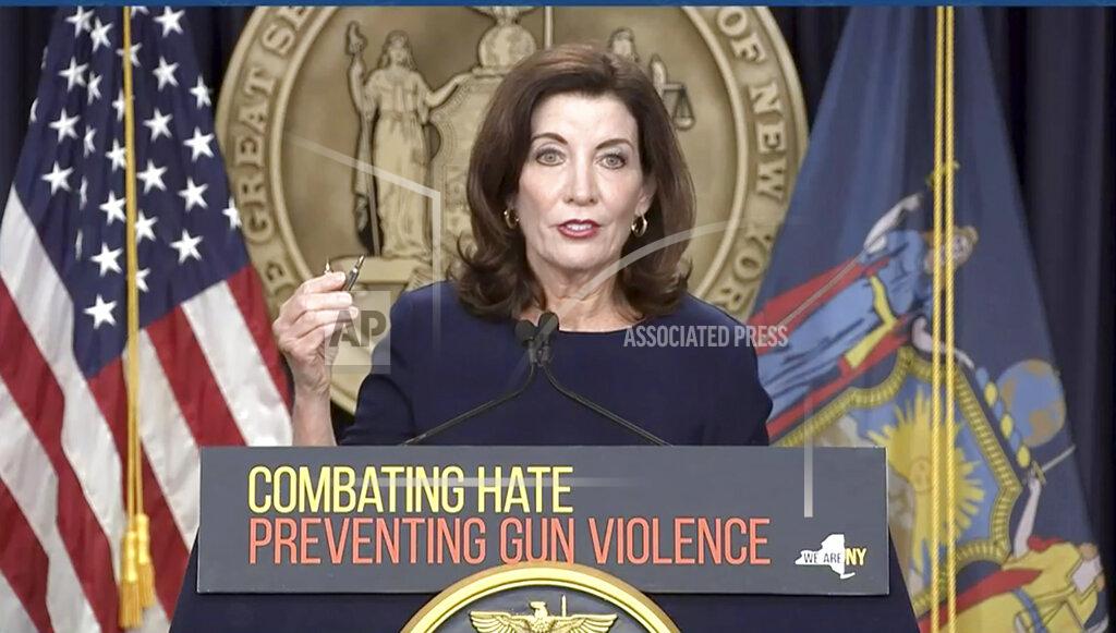 Uncredited In this image taken from video, New York Gov. Kathy Hochul shows bullets similar those used in the the Buffalo supermarket shooting, during a news conference, Wednesday, May 18, 2022, in New York. New York would require state police to seek court orders to keep guns away from people who might pose a threat to themselves or others under a package of executive orders and gun control bills touted Wednesday by Hochul in the aftermath of a racist attack on a Buffalo supermarket. (Office of the Governor of New York via AP)