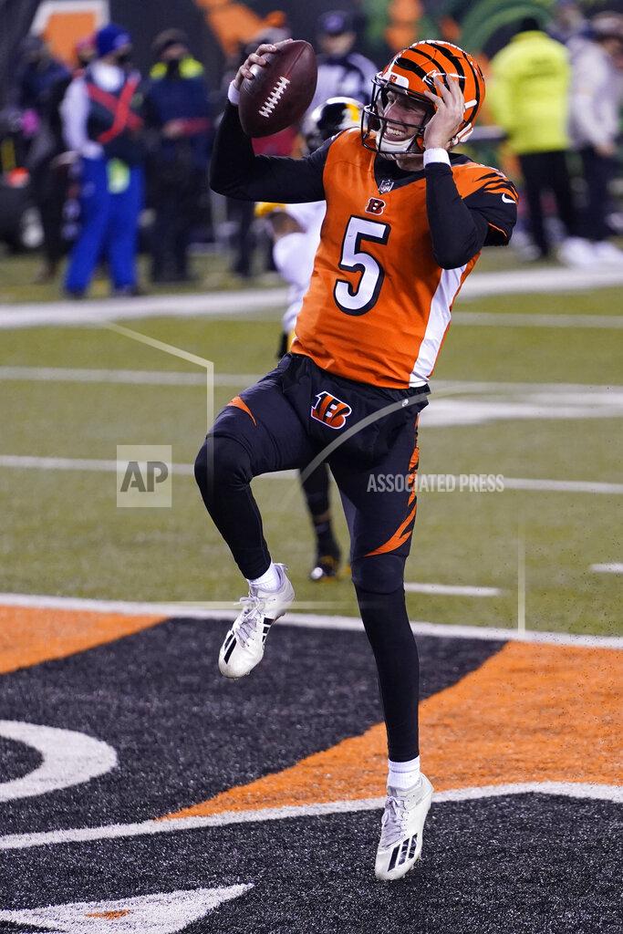 Bryan Woolston Cincinnati Bengals quarterback Ryan Finley reacts after running for a touchdown during the second half of an NFL football game against the Pittsburgh Steelers, Monday, Dec. 21, 2020, in Cincinnati. (AP Photo/Bryan Woolston)