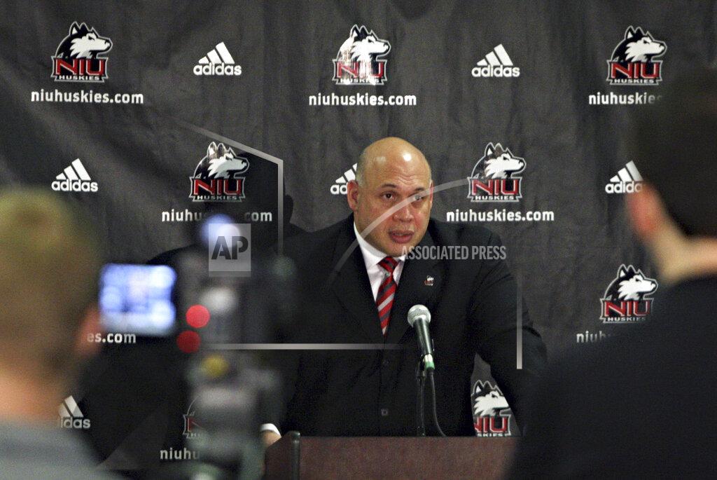 Rob Winner FILE - In this July 16, 2013, file photo, Sean Frazier fields questions from reporters after being introduced as the new athletic director at Northern Illinois University during a news conference in DeKalb, Ill. When college sports teams finally return to action after this hiatus, they might not be traveling quite as far as they did for road games before this pandemic. “It’s about what we can do to stay regionally and local,” Northern Illinois athletic director Sean Frazier said. “If that means postponing a trip to California - pushing that out to later years - yes, we want you to do that.” (Rob Winner/Daily Chronicle via AP, File)