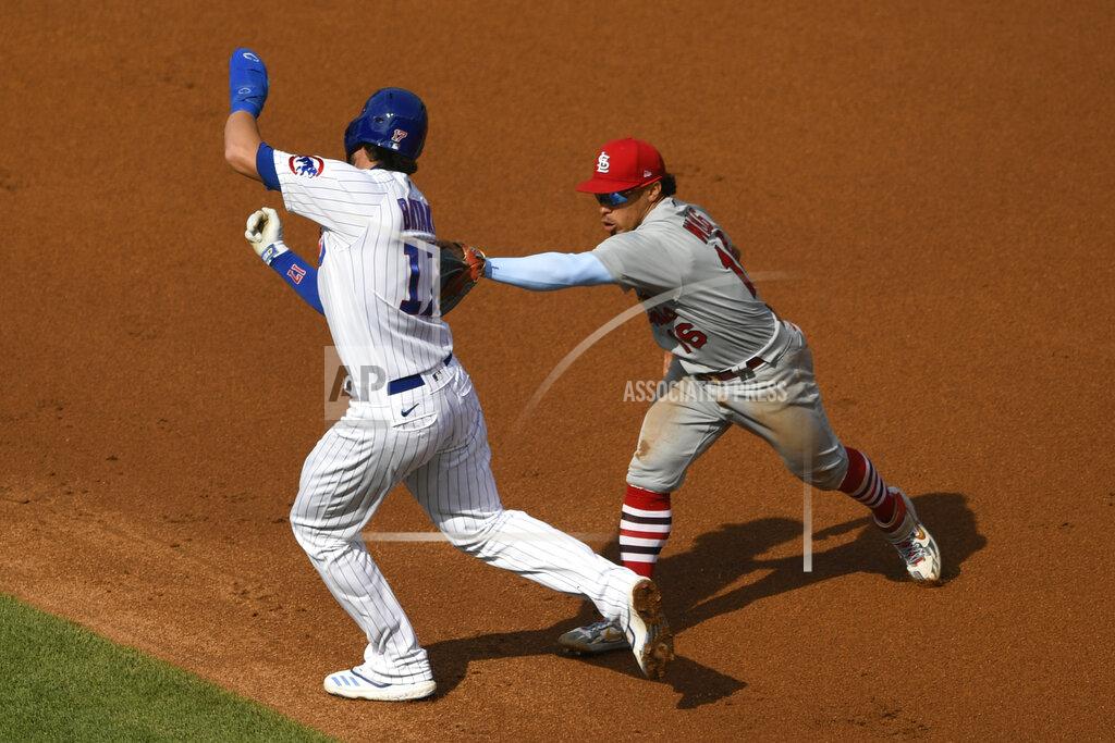 Paul Beaty St. Louis Cardinals second baseman Kolten Wong, right, tags out Chicago Cubs' Kris Bryant between first base and second base during the second inning of a baseball game Monday, Sept. 7, 2020, in Chicago. (AP Photo/Paul Beaty)
