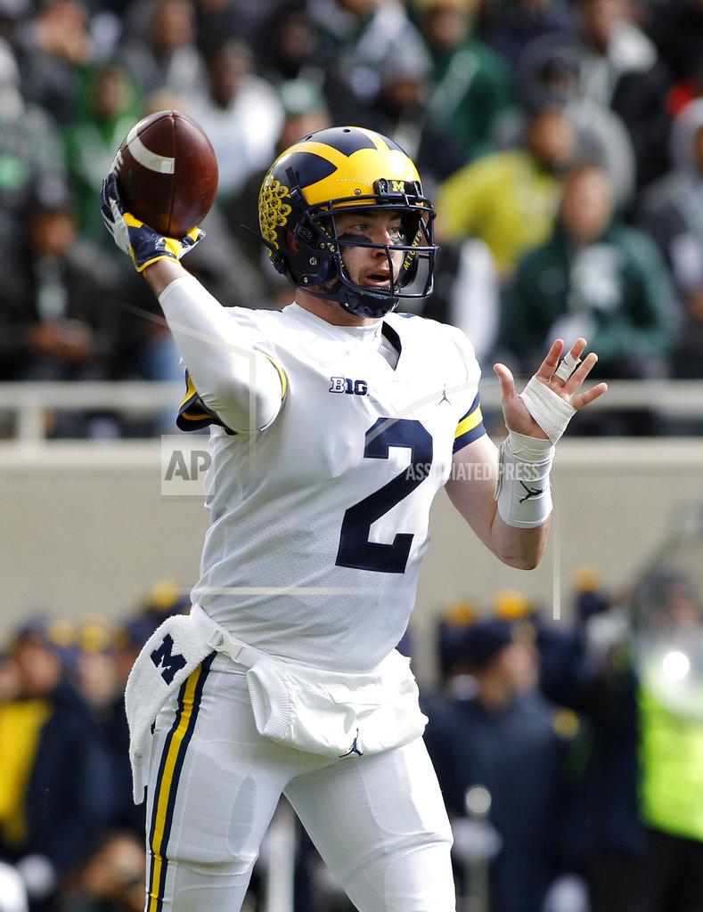 Al Goldis Michigan quarterback Shea Patterson throws a pass against Michigan State during the first quarter of an NCAA college football game, Saturday, Oct. 20, 2018, in East Lansing, Mich. (AP Photo/Al Goldis)