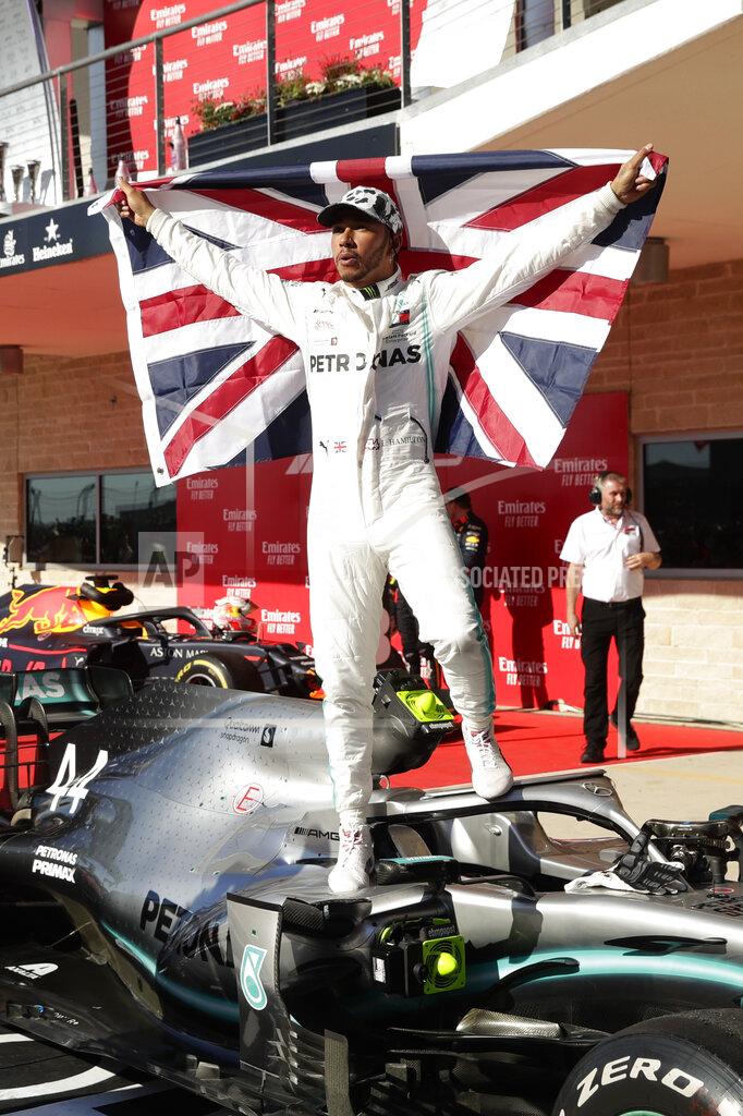 Eric Gay Mercedes driver Lewis Hamilton, of Britain, celebrates after the Formula One U.S. Grand Prix auto race at the Circuit of the Americas, Sunday, Nov. 3, 2019, in Austin, Texas. (AP Photo/Eric Gay)