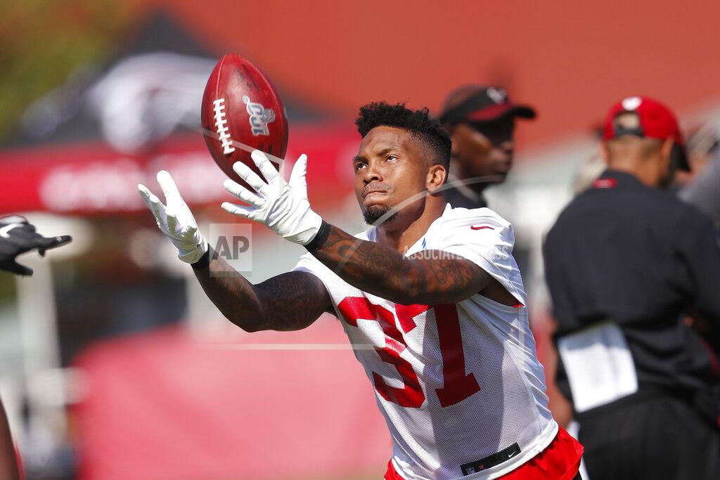 Atlanta Falcons free safety Ricardo Allen (37) tosses a ball in the air during their NFL training camp football practice Thursday, July 25, 2019, in Flowery Branch, Ga.(AP Photo/John Bazemore)
