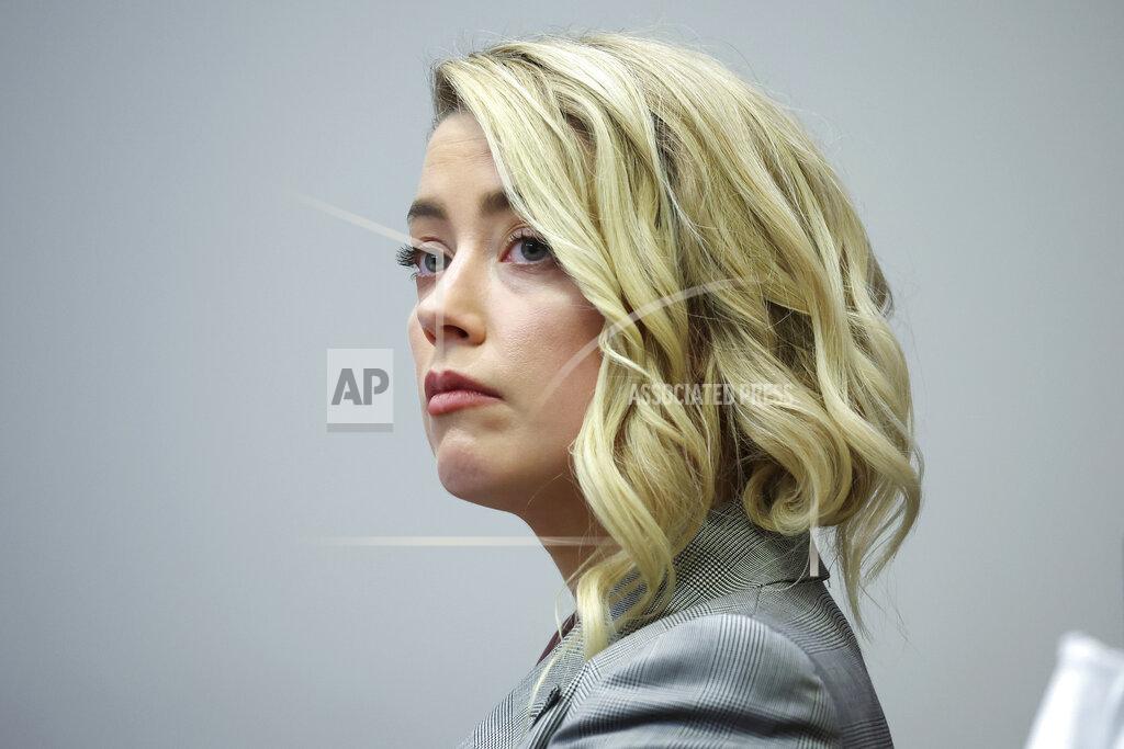 Michael Reynolds Actor Amber Heard appears in the courtroom in the Fairfax County Circuit Courthouse in Fairfax, Va., Thursday, May 26, 2022. Actor Johnny Depp sued his ex-wife Amber Heard for libel in Fairfax County Circuit Court after she wrote an op-ed piece in The Washington Post in 2018 referring to herself as a "public figure representing domestic abuse." (Michael Reynolds/Pool Photo via AP)