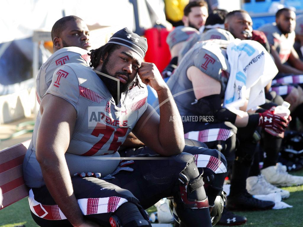 Rogelio V. Solis Temple offensive lineman Darian Bryant (75) and other players sit on the bench after the Independence Bowl NCAA college football game against Duke in Shreveport, La., Thursday, Dec. 27, 2018. (AP Photo/Rogelio V. Solis)