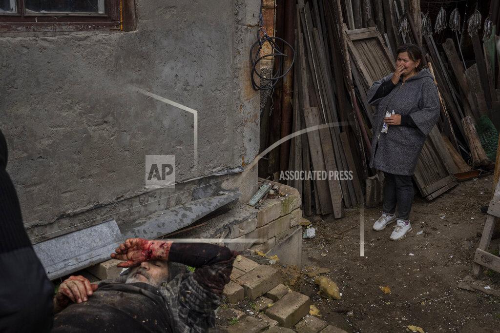 Bernat Armangue Viktor Anastasiev's wife cries near her wounded husband after a Russian strike in Kherson, southern Ukraine, Thursday, Nov. 24, 2022. (AP Photo/Bernat Armangue)