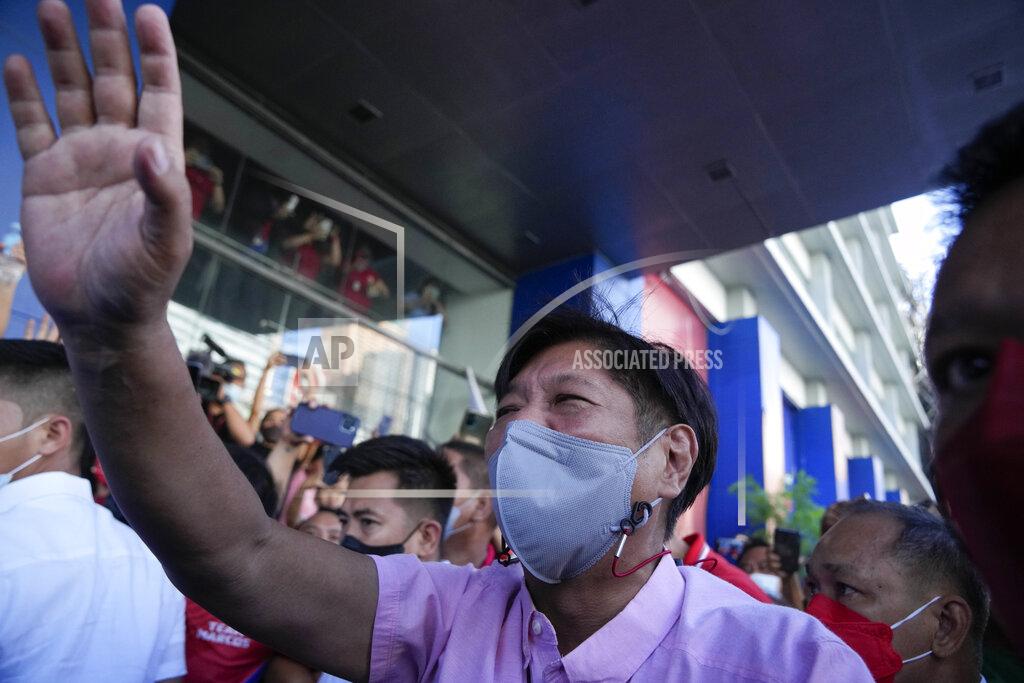 Aaron Favila Presidential candidate Ferdinand "Bongbong" Marcos Jr. greets the crowd as he celebrates outside his headquarters in Mandaluyong, Philippines on Wednesday, May 11, 2022. Marcos' apparent landslide victory in the Philippine presidential election is raising immediate concerns about a further erosion of democracy in Asia and could complicate American efforts to blunt growing Chinese influence and power in the Pacific. (AP Photo/Aaron Favila)
