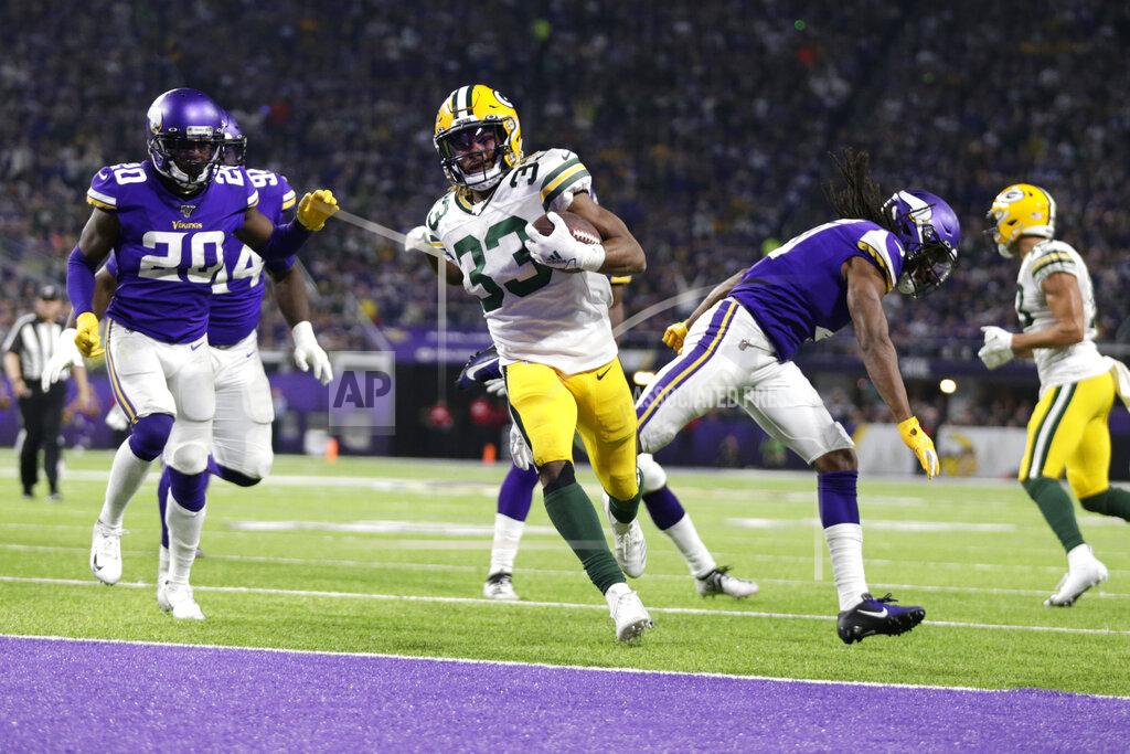 Andy Clayton-King Green Bay Packers running back Aaron Jones (33) scores on a 12-yard touchdown run during the second half of the team's NFL football game against the Minnesota Vikings, Monday, Dec. 23, 2019, in Minneapolis. (AP Photo/Andy Clayton-King)