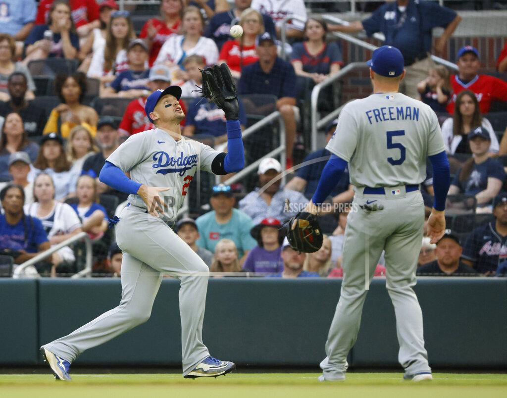 Bob Andres Los Angeles Dodgers right fielder Trayce Thompson makes an out against Atlanta Braves lead-off batter Dansby Swanson as Freddie Freeman (5) covers during the first inning of a baseball game Sunday, June 26, 2022, in Atlanta. (AP Photo/Bob Andres)