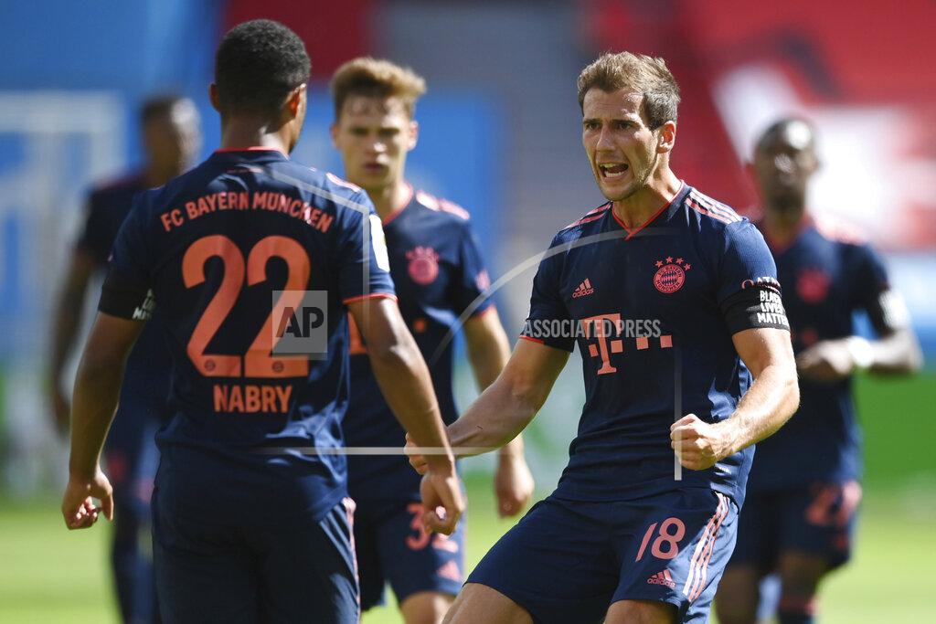 Matthias Hangst Serge Gnabry, left, of Munich celebrates his team's third goal with teammate Leon Goretzka during the German Bundesliga soccer match between Bayer Leverkusen and Bayern Munich in Leverkusen, Germany, Saturday, June 6, 2020. (Matthias Hangst, Pool via AP)
