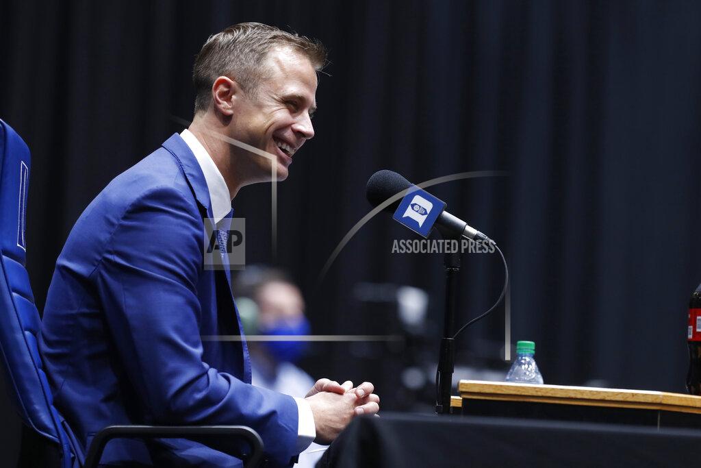 Ethan Hyman Jon Scheyer laughs during an NCAA college basketball press conference at Cameron Indoor Stadium in Durham, N.C., Friday, June 4, 2021. Scheyer will spend the upcoming year in his role as associate head coach as coach Mike Krzyzewski chases one more championship in a Hall of Fame career. Then it’s up to the 33-year-old Scheyer to take over ahead of the 2022-23 season in the program’s first coaching change in more than four decades. (Ethan Hyman/The News & Observer via AP)