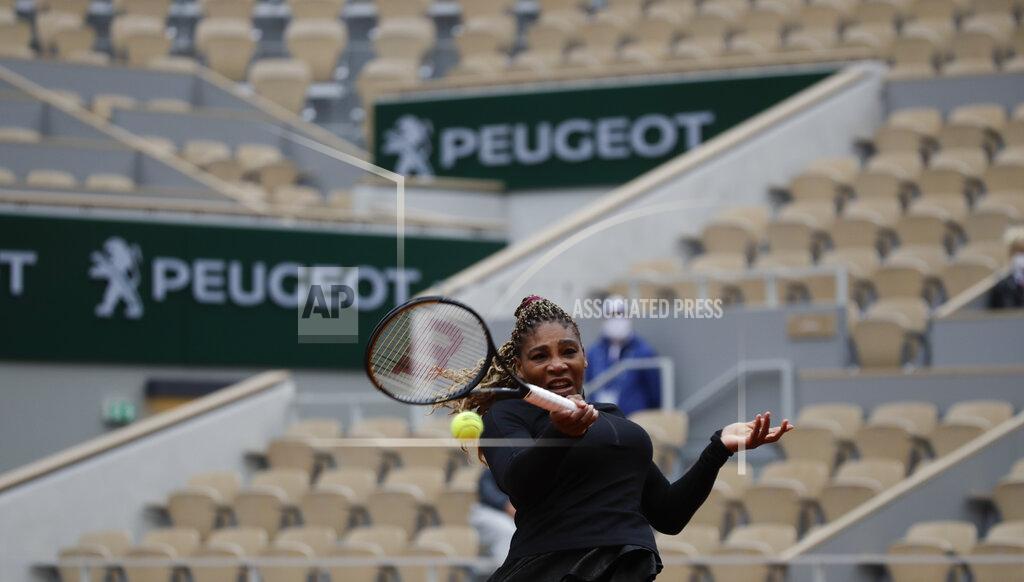 Alessandra Tarantino Serena Williams of the U.S. plays a shot against Kristie Ahn of the U.S. in a near-empty center court Philippe Chatrier in the first round match of the French Open tennis tournament at the Roland Garros stadium in Paris, France, Monday, Sept. 28, 2020. (AP Photo/Alessandra Tarantino)