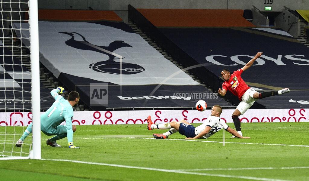 Glyn Kirk Manchester United's Anthony Martial, right, attempts a shot on goal during the English Premier League soccer match between Tottenham Hotspur and Manchester United at Tottenham Hotspur Stadium in London, England, Friday, June 19, 2020. (AP Photo/Glyn Kirk, Pool)