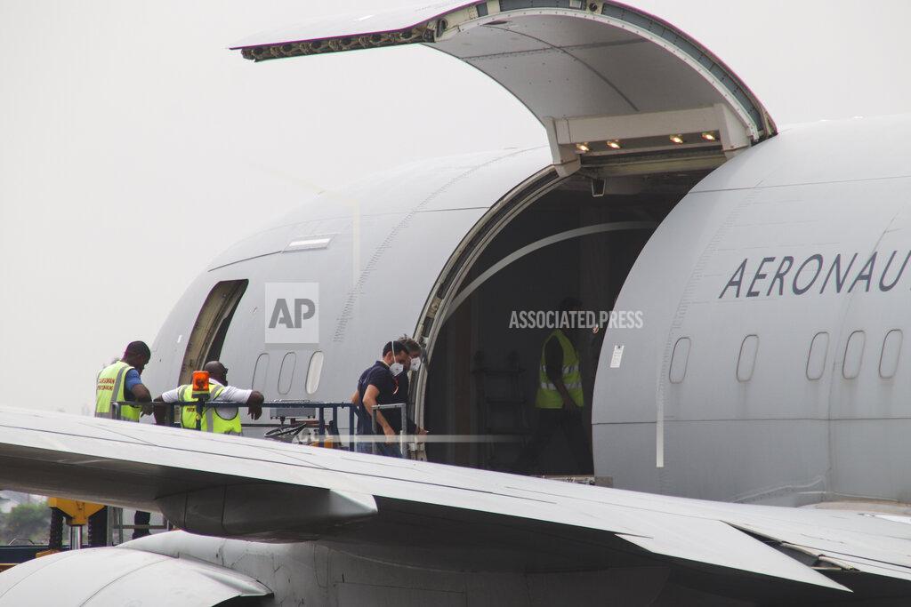 Justin Kabumba Unidentified people on an airplane after it arrived to transport the bodies of Italian ambassador to Congo Luca Attanasio and Carabinieri officer Vittorio Iacovacci to the capital Kinshasa, at the airport in Goma, North Kivu province, Congo Tuesday, Feb. 23, 2021. Congo has dispatched a team to support investigators on the ground in Goma where the Italian ambassador to Congo, an Italian Carabinieri police officer and their driver were ambushed and killed Monday. (AP Photo/Justin Kabumba)