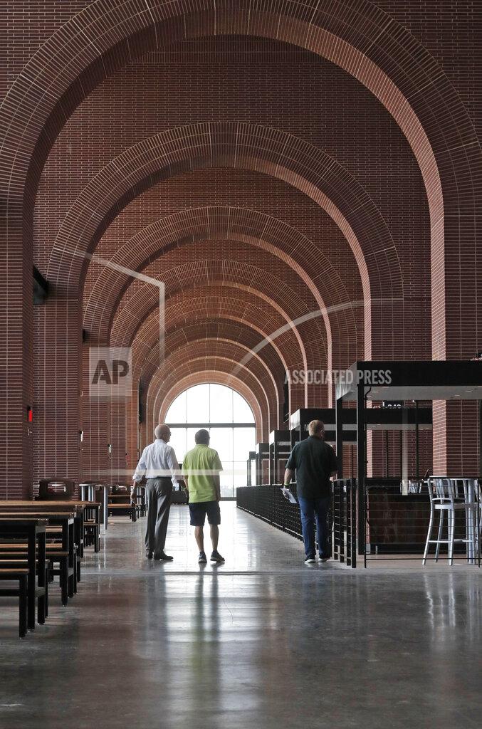 Lm Otero In this photo made Thursday, July 23, 2020, an view of the walkway arches are shown at the new Texas Rangers home baseball stadium named Globe Life Field in Arlington, Texas. The Texas Rangers' new stadium isn't retro and designers wanted the first next-generation ballpark. There is the full-panel retractable roof, the split seating levels offering full views of the ballpark with plenty of natural light. (AP Photo/LM Otero)