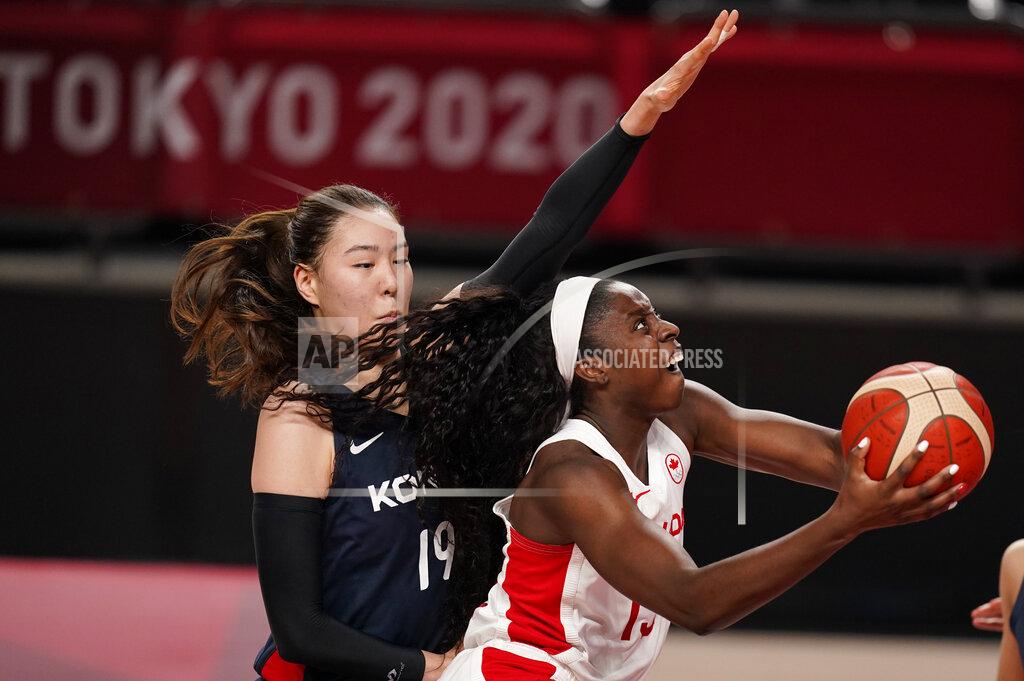 Charlie Neibergall Canada's Laeticia Amihere (15), right, drives to the basket past South Korea's Ji Su Park (19) during women's basketball preliminary round game at the 2020 Summer Olympics, Thursday, July 29, 2021, in Saitama, Japan. (AP Photo/Charlie Neibergall)