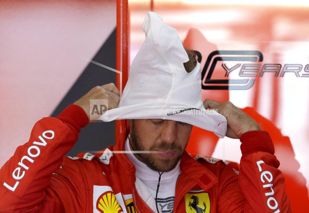 Ferrari driver Sebastian Vettel of Germany prepares at pits during the second free practice at the Paul Ricard racetrack in Le Castellet, southern France, Friday, June 21, 2019. The French Formula One Grand Prix will be held on Sunday. (AP Photo/Claude Paris)