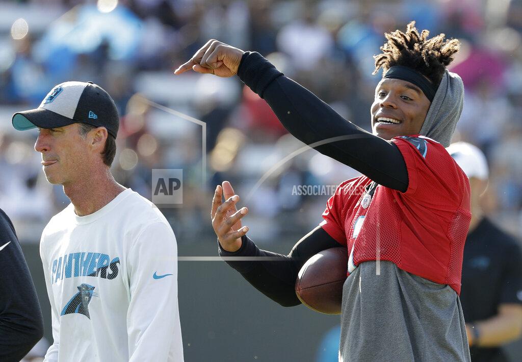 Chuck Burton Carolina Panthers quarterback Cam Newton, right, jokes with head trainer Ryan Vermillion, left, during practice at the NFL football team's training camp in Spartanburg, N.C., Thursday, July 25, 2019. (AP Photo/Chuck Burton)