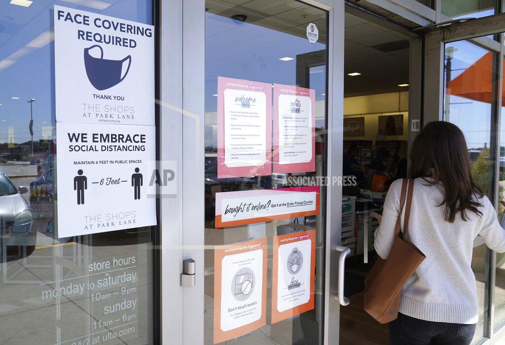 Lm Otero A customer enters a store with a face mask required sign displayed Tuesday, March 2, 2021, in Dallas. Texas is lifting a COVID-19 mask mandate that was imposed last summer but has only been lightly enforced. Republican Gov. Greg Abbott’s announcement Tuesday makes Texas the largest state to do away with a face covering order. (AP Photo/LM Otero)