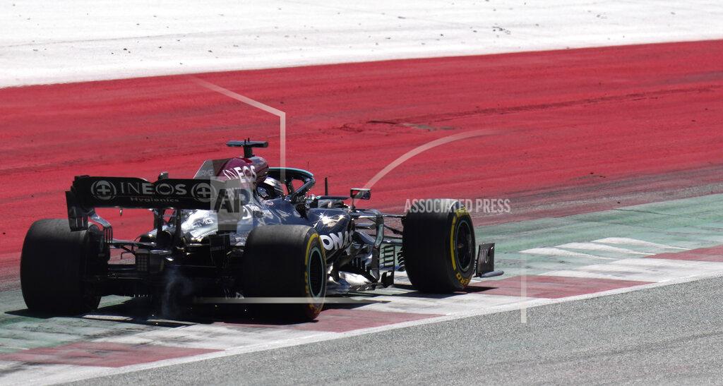 Darko Bandic Mercedes driver Lewis Hamilton of Britain steers his car during the qualifying session for the Austrian Formula One Grand Prix at the Red Bull Ring racetrack in Spielberg, Austria, Saturday, July 3, 2021. The Austrian Grand Prix will be held on Sunday. (AP Photo/Darko Bandic)