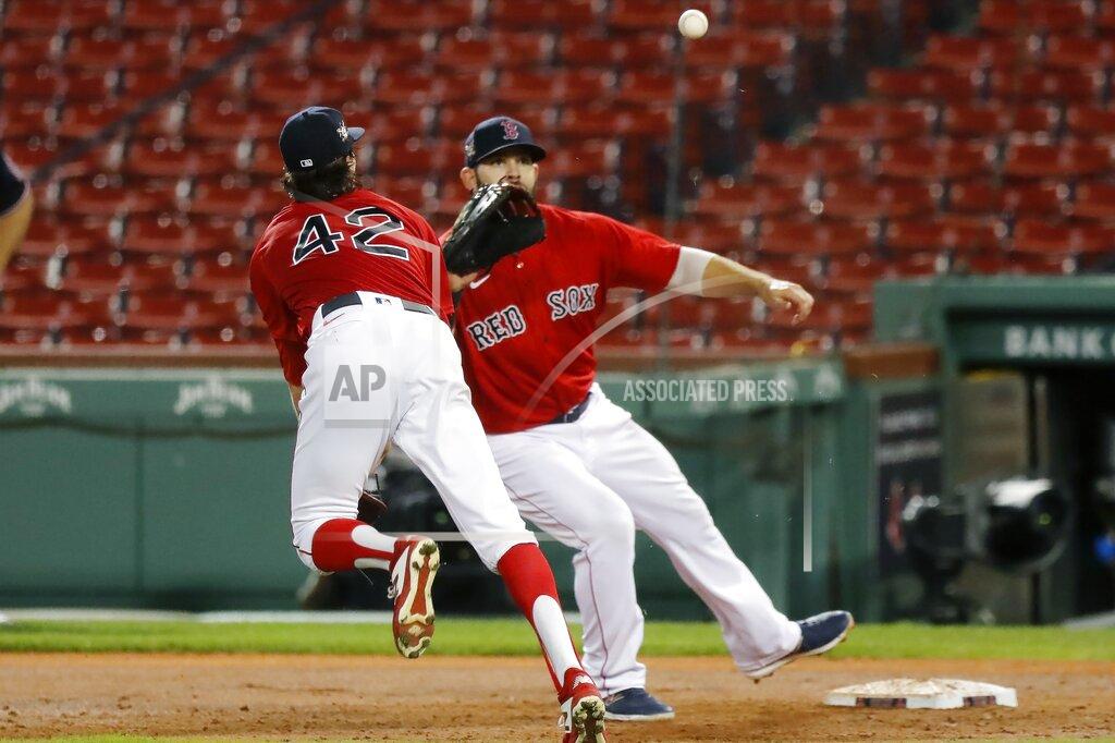 Michael Dwyer Boston Red Sox's Chris Mazza, left, makes a throwing error to Mitch Moreland on a single by Washington Nationals' Juan Soto during the third inning of a baseball game, Saturday, Aug. 29, 2020, in Boston. (AP Photo/Michael Dwyer)
