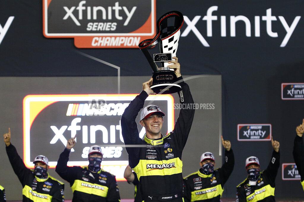 Ralph Freso Austin Cindric holds up the season championship trophy in Victory Lane after winning the NASCAR Xfinity Series auto race at Phoenix Raceway, Saturday, Nov. 7, 2020, in Avondale, Ariz. (AP Photo/Ralph Freso)