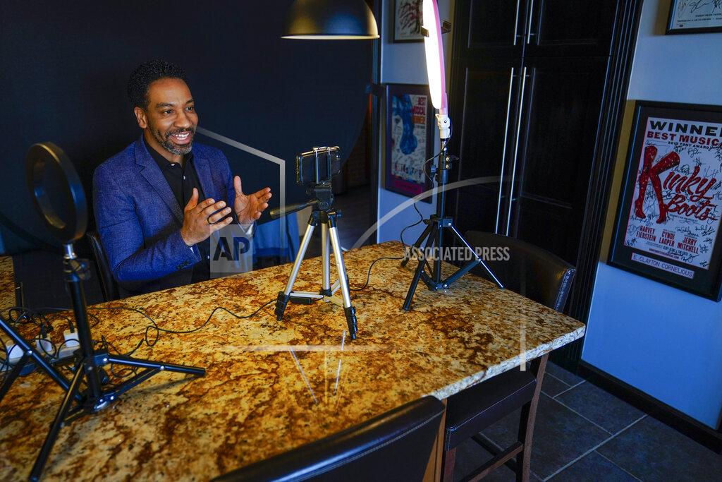 Mary Altaffer Actor E. Clayton Cornelious poses for a photo in the makeshift studio set up in his home for auditioning, Monday, March 22, 2021, in New York. He’s looking forward to seeing Broadway reopen. The city is preparing for that to happen this fall. “You can’t take away that live theater feeling,” Cornelious said. “I’m pretty sure that theater is going to survive and people are going to come.” (AP Photo/Mary Altaffer)