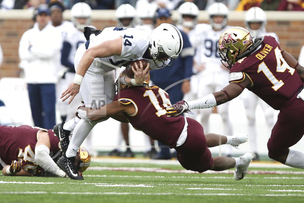 Stacy Bengs Penn State quarterback Sean Clifford (14) is tackled by Minnesota defensive back Coney Durr (16) during an NCAA college football game, Saturday, Nov. 9, 2019, in Minneapolis. (AP Photo/Stacy Bengs)
