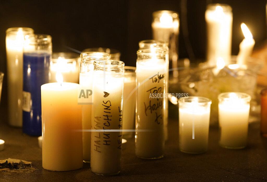 Chris Pizzello Candles flicker during a vigil for the late cinematographer Halyna Hutchins, Sunday, Oct. 24, 2021, in Burbank, Calif. A prop firearm discharged last Thursday by actor Alec Baldwin, while producing and starring in a Western movie in Santa Fe, N.M., killed Hutchins and wounded director Joel Souza. (AP Photo/Chris Pizzello)