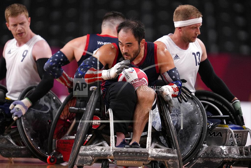 Shuji Kajiyama Charles Aoki of the United States holds the ball during the wheelchair rugby gold medal match against Britain at the Tokyo 2020 Paralympic Games, Sunday, Aug. 29, 2021, in Tokyo, Japan. (AP Photo/Shuji Kajiyama)