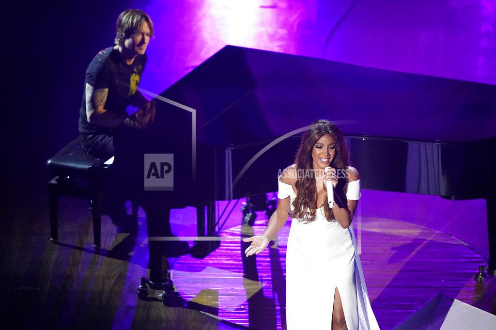 Mark Humphrey Mickey Guyton, right, and Keith Urban perform "What Are You Gonna Tell Her?" during the 55th annual Academy of Country Music Awards at the Grand Ole Opry House on Wednesday, Sept. 16, 2020, in Nashville, Tenn. (AP Photo/Mark Humphrey)