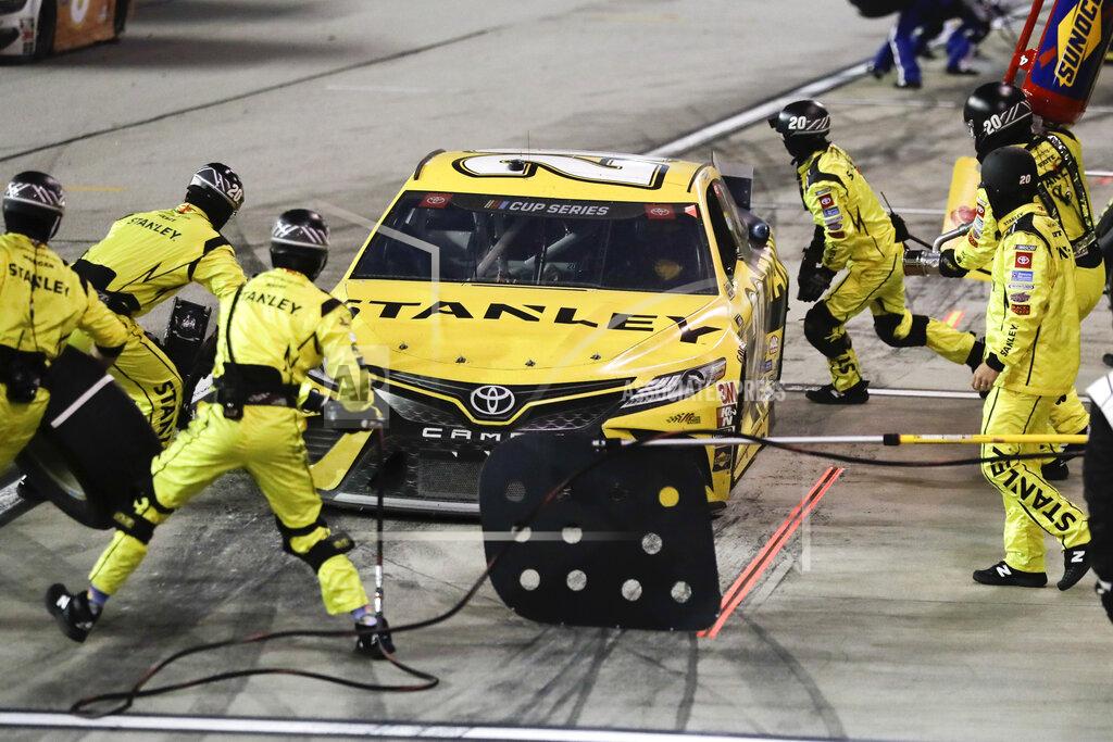 Brynn Anderson Erik Jones (20) makes a pit stop during the NASCAR Cup Series auto race Wednesday, May 20, 2020, in Darlington, S.C. (AP Photo/Brynn Anderson)