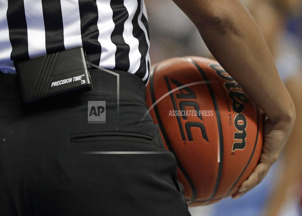 Chuck Burton In this photo taken March 8, 2019, A Precision Time unit is shown attached to an official during the first half of an Atlantic Coast Conference women's tournament basketball game in Greensboro, N.C. The Precision Time system created more than two decades ago by former referee Mike Costabile currently is used at nearly every level of the sport, including the NBA and college basketball's NCAA Tournament. Costabile estimates the ability to stop the clock automatically on a referee's whistle can save roughly 90 seconds formerly lost to reaction time when timekeepers manually stopped the clock. (AP Photo/Chuck Burton)