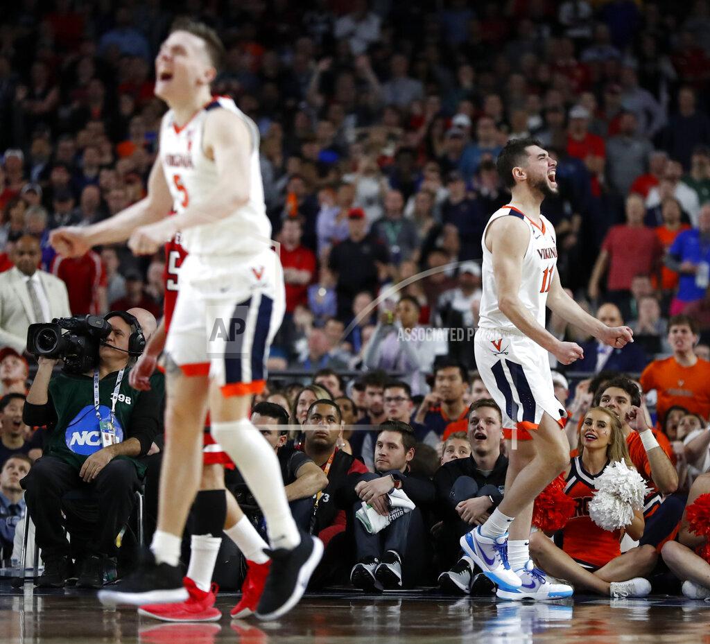 Jeff Roberson Virginia's Kyle Guy (5) and Ty Jerome (11) react to a play during the overtime in the championship of the Final Four NCAA college basketball tournament against Texas Tech, Monday, April 8, 2019, in Minneapolis. (AP Photo/Jeff Roberson)