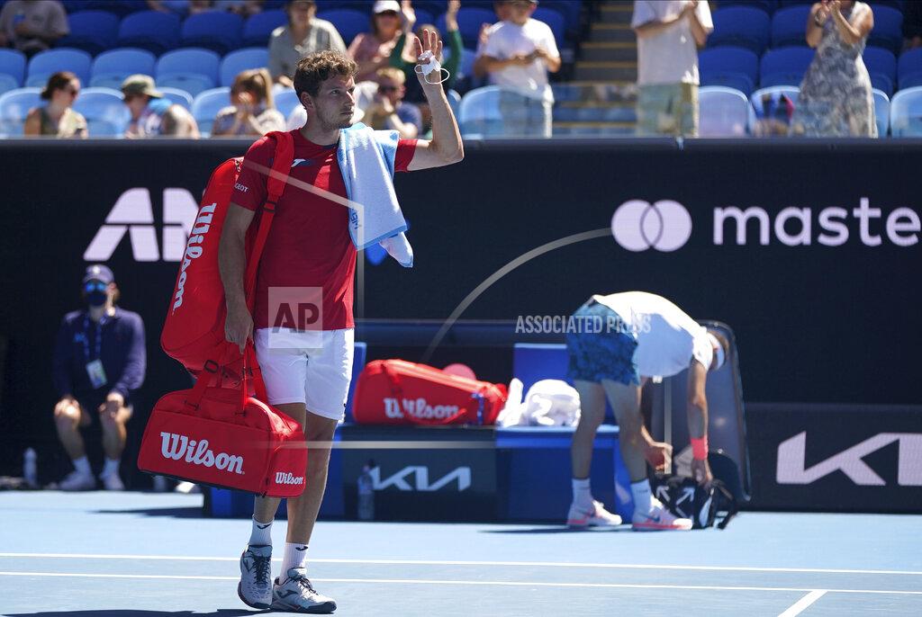 Natasha Morello Spain's Pablo Carreno Busta, left, waves as he leaves the court after he retired in his third round match against Buglaria's Grigor Dimitrov at the Australian Open tennis championship in Melbourne, Australia, Friday, Feb. 12, 2021. (Natasha Morello/Tennis Australia via AP)