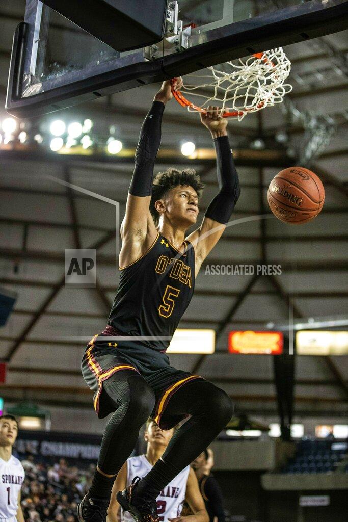 Dean Rutz FILE - O'Dea's Paolo Banchero dunks against Mount Spokane in the fourth quarter during the 3A Boys State Basketball Championship at the Tacoma Dome, in Tacoma, Washington, in this Saturday, March 2, 2019, file photo. Banchero is the headliner in Duke's latest top-flight recruiting class, a 6-foot-10, 250-pound power forward widely regarded as a potential top NBA draft pick whenever he goes pro. He's also set to be the top threat for a Blue Devils team preparing for its final season under Hall of Famer Mike Krzyzewski. (Dean Rutz/The Seattle Times via AP, File)