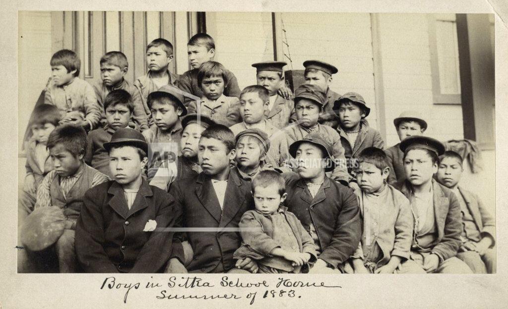 Uncredited This photo made available by the Presbyterian Historical Society, Philadelphia shows students at a Presbyterian boarding school in Sitka, Alaska in the summer of 1883. U.S. Catholic and Protestant denominations operated more than 150 boarding schools between the 19th and 20th centuries. Native American and Alaskan Native children were regularly severed from their tribal families, customs, language and religion and brought to the schools in a push to assimilate and Christianize them. (Presbyterian Historical Society, Philadelphia via AP)