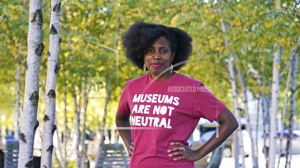 Tony Dejak La Tanya Autry, a curatorial fellow at The Museum of Contemporary Art Cleveland, poses outside of the museum in Cleveland on Thursday, Oct. 8, 2020. Museums are being called on to examine what's on their walls amid a national reckoning on racism. Among 18 major U.S. museums, 85% of artists featured are white, while 87% are men, according to a 2019 study conducted at Williams College. Autry helped start an initiative called Museums Are Not Neutral. (AP Photo/Tony Dejak)