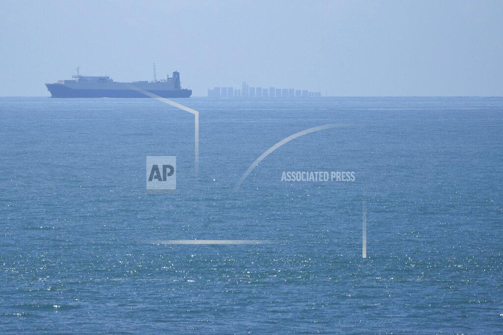 Ng Han Guan Ships move through the Taiwan Strait as seen from the 68-nautical-mile scenic spot, the closest point in mainland China to the island of Taiwan, in Pingtan in southeastern China's Fujian Province, Friday, Aug. 5, 2022. China conducted "precision missile strikes" Thursday in waters off Taiwan's coasts as part of military exercises that have raised tensions in the region to their highest level in decades following a visit by U.S. House Speaker Nancy Pelosi. (AP Photo/Ng Han Guan)
