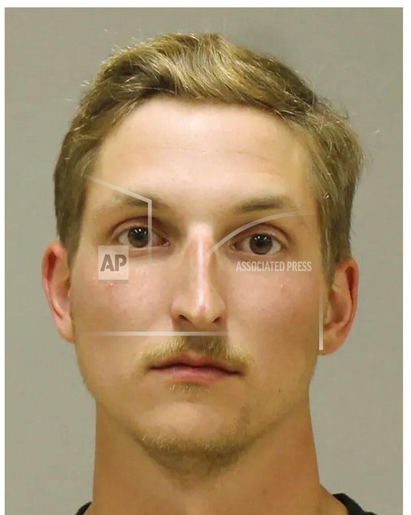Uncredited In a photo provided by the Kent County Sheriff, Daniel Harris is shown in a booking photo. Harris is one of several people charged with plotting to kidnap Michigan Democratic Gov. Gretchen Whitmer, authorities said Thursday, Oct. 8, 2020, in announcing charges in an alleged scheme that involved months of planning and even rehearsals to snatch Whitmer from her vacation home. (Kent County Sheriff via AP)