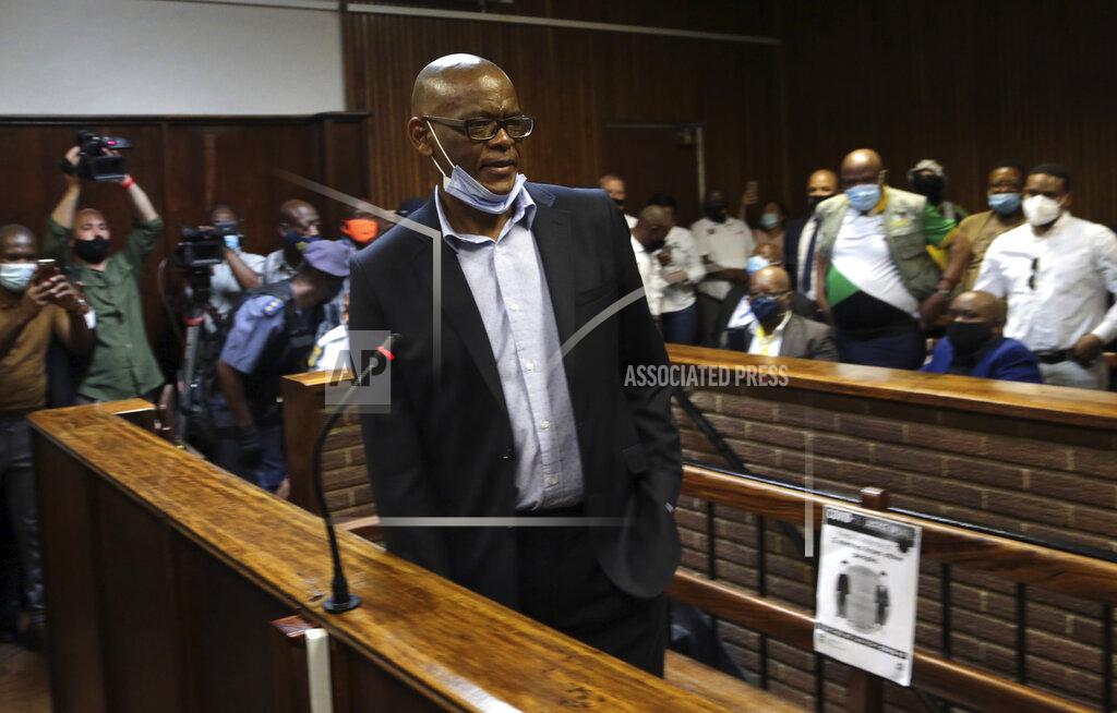 Uncredited African National Congress secretary general Ace Magashule appears for a bail hearing inside the magistrates court in Bloemfontein, South Africa, Friday, Nov. 13, 2020. Magashule is charged in connection with the looting of $13.8 million when he was premier of the Free State province from 2009 until 2018. (AP Photo)