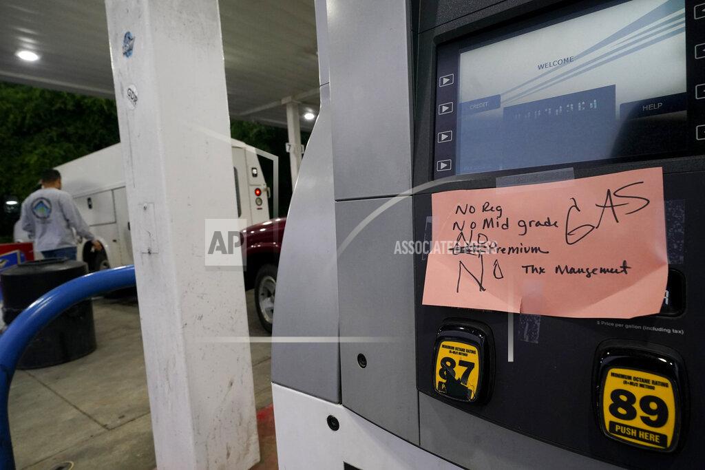 Chris Carlson A hand written sign is posted on a gas pump, showing that the service station is out of all grades of fuel Wednesday, May 12, 2021, in Charlotte, N.C. Several gas stations in the Southeast reported running out of fuel, primarily because of what analysts say is unwarranted panic-buying among drivers, as the shutdown of a major pipeline by hackers entered its fifth day. (AP Photo/Chris Carlson)