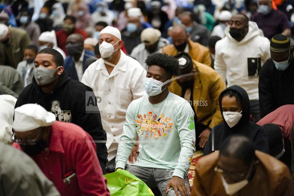 Matt Rourke Worshippers perform an Eid al-Fitr prayer at the Masjidullah Mosque in Philadelphia, Thursday, May 13, 2021. Millions of Muslims across the world are marking a muted and gloomy holiday of Eid al-Fitr, the end of the fasting month of Ramadan - a usually joyous three-day celebration that has been significantly toned down as coronavirus cases soar. (AP Photo/Matt Rourke)