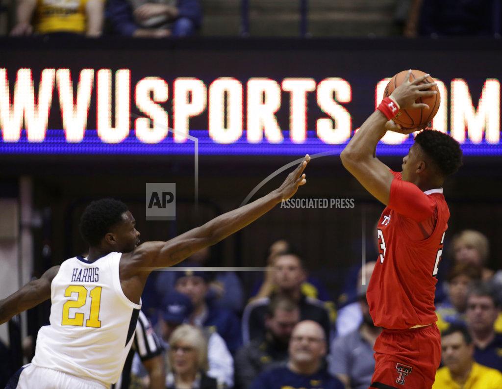 Ray Thompson Texas Tech guard Jarrett Culver (23) shoots while defended by West Virginia forward Wesley Harris (21) during the second half of an NCAA college basketball game Wednesday, Jan. 2, 2019, in Morgantown, W.Va. Texas Tech defeated West Virginia 62-59. (AP Photo/Raymond Thompson)