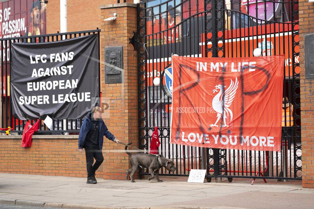 Jon Super Banners are seen outside Liverpool's Anfield Stadium after the collapse of English involvement in the proposed European Super League, Liverpool, England, Wednesday, April 21, 2021. Liverpool owner John W Henry has apologised to the club's supporters for the "disruption" caused by the proposed European Super League (ESL). (AP Photo/Jon Super)