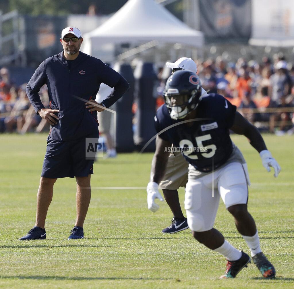 Nam Huh Chicago Bears head coach Matt Nagy, left, watches running back Mike Davis (25) during an NFL football training camp in Bourbonnais, Ill., Sunday, July 28, 2019. (AP Photo/Nam Y. Huh)