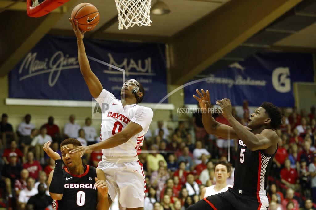 Marco Garcia Dayton guard Rodney Chatman (0) goes to the basket between Georgia guards Donnell Gresham Jr. (0) and Anthony Edwards (5) during the first half of an NCAA college basketball game Monday, Nov. 25, 2019, in Lahaina, Hawaii. (AP Photo/Marco Garcia)