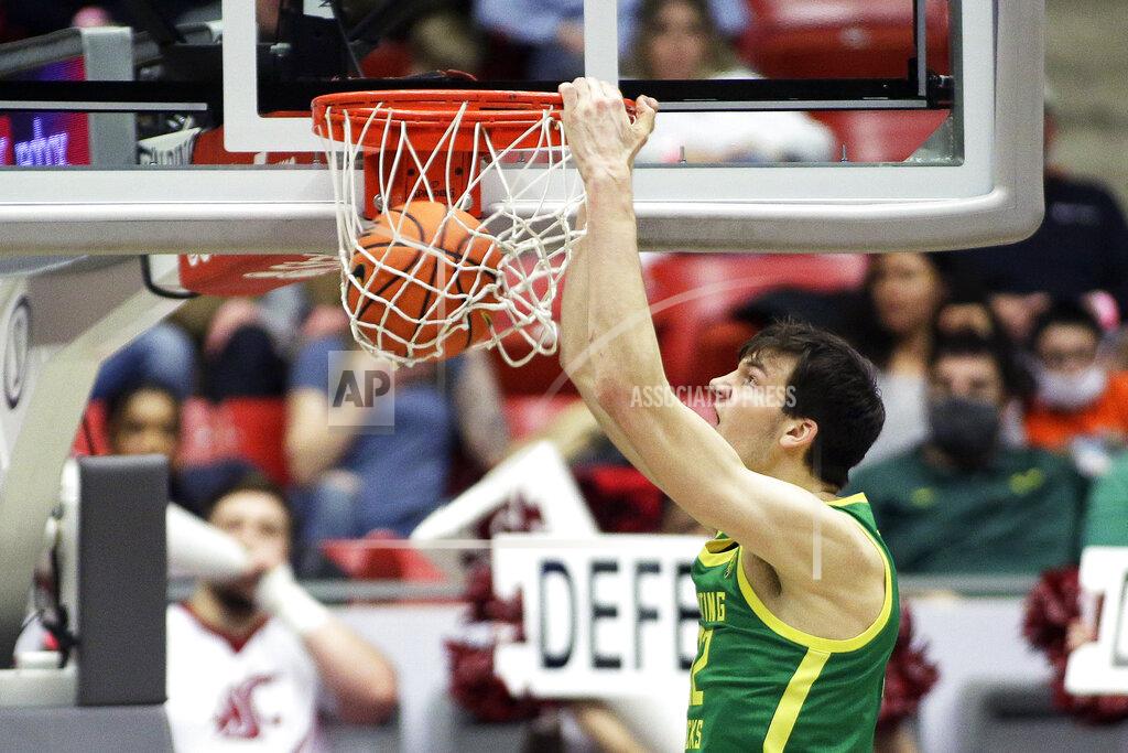 Young Kwak Oregon center Nate Bittle dunks during the second half of an NCAA college basketball game against Washington State, Saturday, March 5, 2022, in Pullman, Wash. Washington State won 94-74. (AP Photo/Young Kwak)
