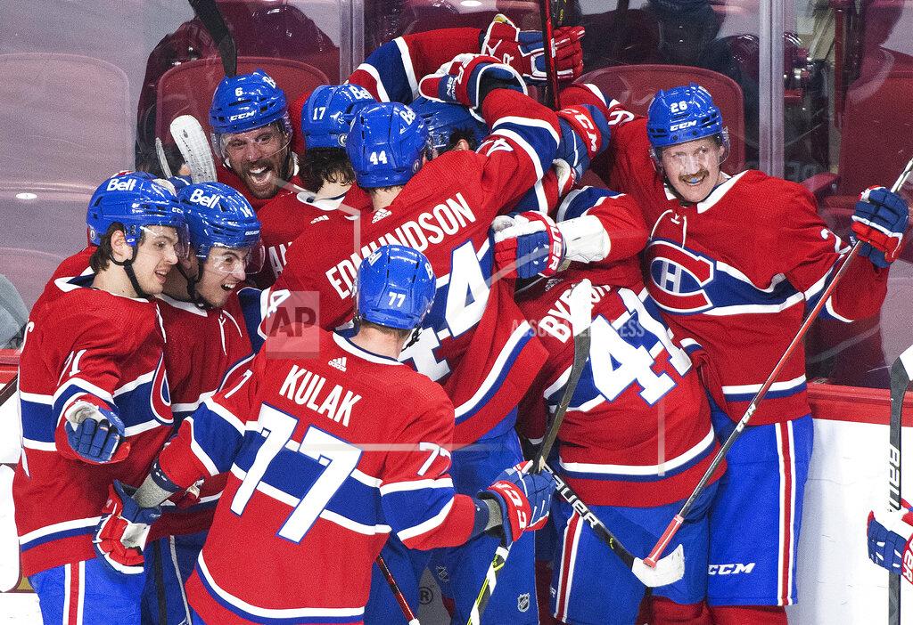 Graham Hughes Montreal Canadiens' Jesperi Kotkaniemi (15) celebrates with teammates after scoring against the Toronto Maple Leafs during overtime in Game 6 of an NHL hockey Stanley Cup first-round playoff seres Saturday, May 29, 2021, in Montreal. (Graham Hughes/The Canadian Press via AP)